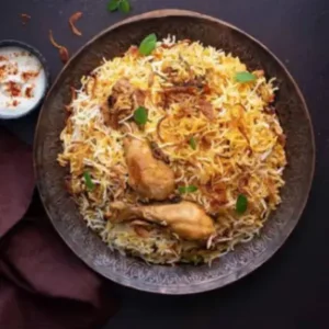 Menu Authentic Hyderabadi chicken biryani with basmati rice, tender chicken and aromatic spices at RAASARA